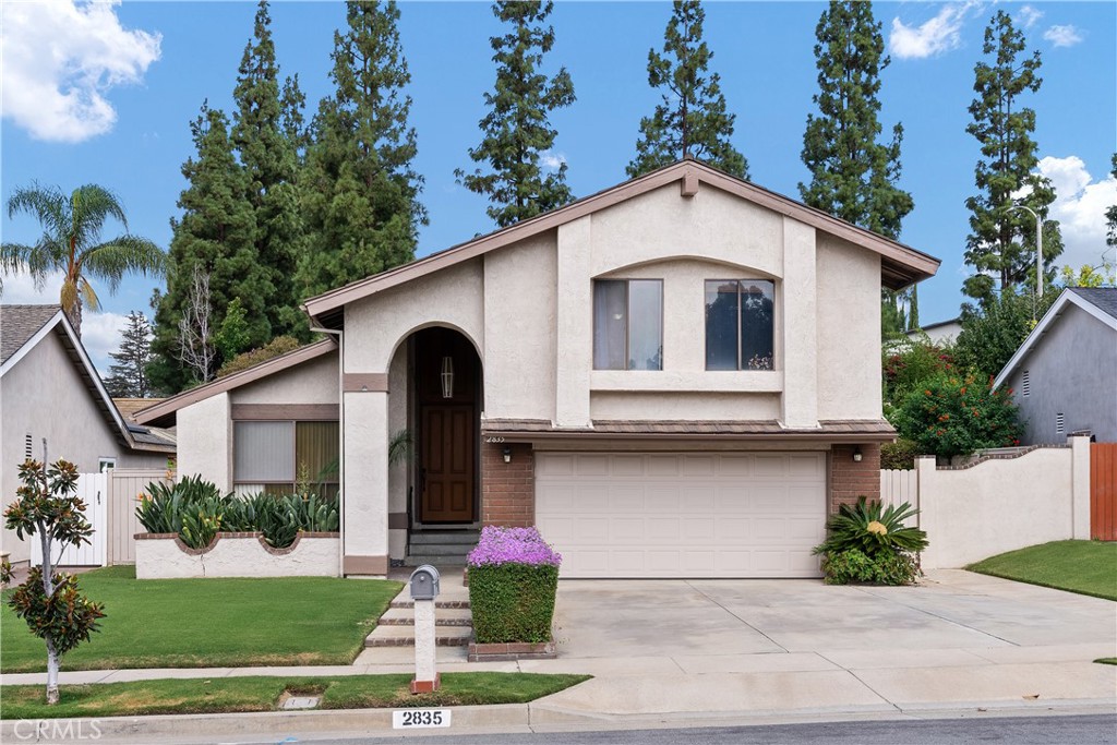 2835 Treeview Place Fullerton, CA 92835 - Photo 1 of 1 a front view of a house with a yard