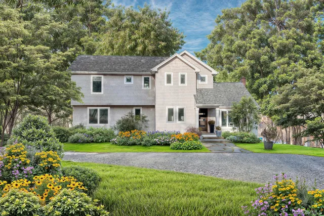 a front view of a house with yard