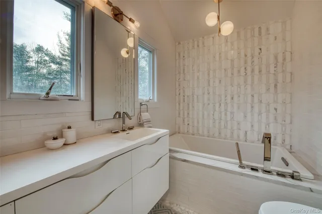 a bedroom with a bed wooden floor and window