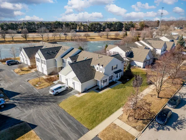 an aerial view of a house with outdoor space