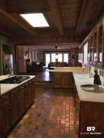 3961 Victoria Drive Theodore, AL 36582 - Photo 6 of 25 kitchen connects to the morning room leading outside onto the deck that overlooks the canal