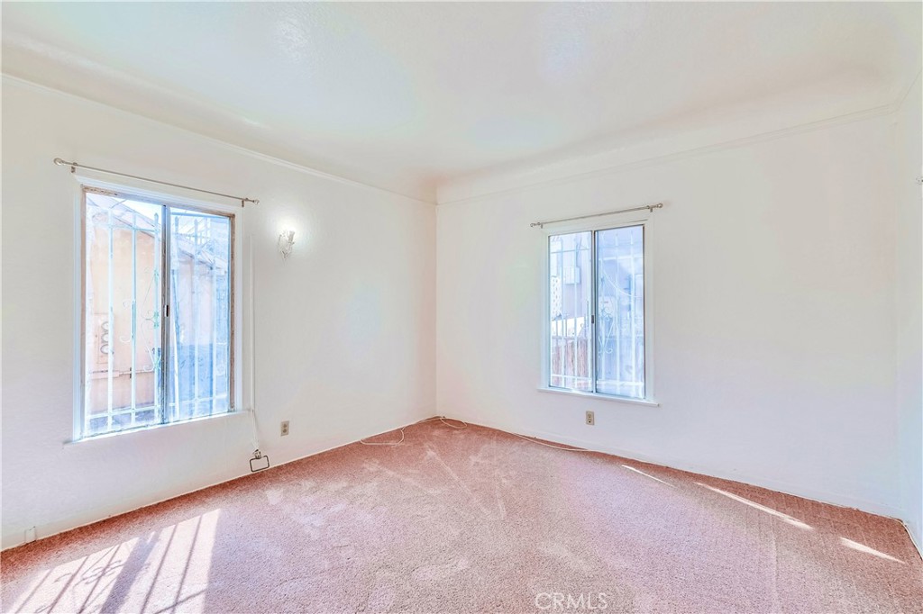 234 Lime Avenue, Unit A Long Beach, CA 90802 - Photo 11 of 15 an empty room with windows and closet