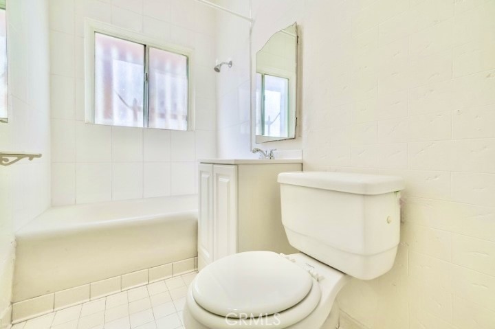 234 Lime Avenue, Unit A Long Beach, CA 90802 - Photo 12 of 15 a white toilet sitting next to a bath tub