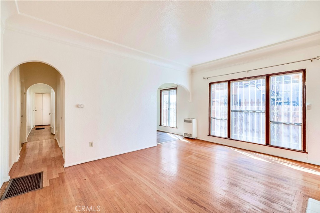 234 Lime Avenue, Unit A Long Beach, CA 90802 - Photo 3 of 15 a view of empty room with wooden floor and fan