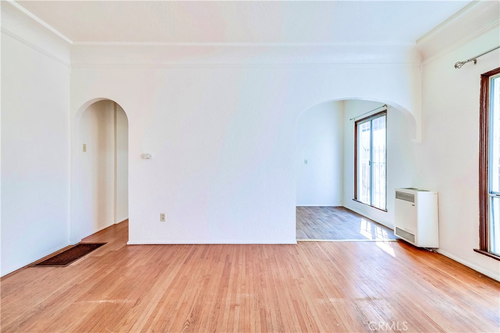 234 Lime Avenue, Unit A Long Beach, CA 90802 - Photo 5 of 15 an empty room with wooden floor and closet