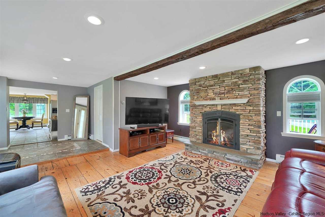 78 E Road Wallkill, NY 12589 - Photo 11 of 27 a living room with furniture flat screen tv and a fireplace