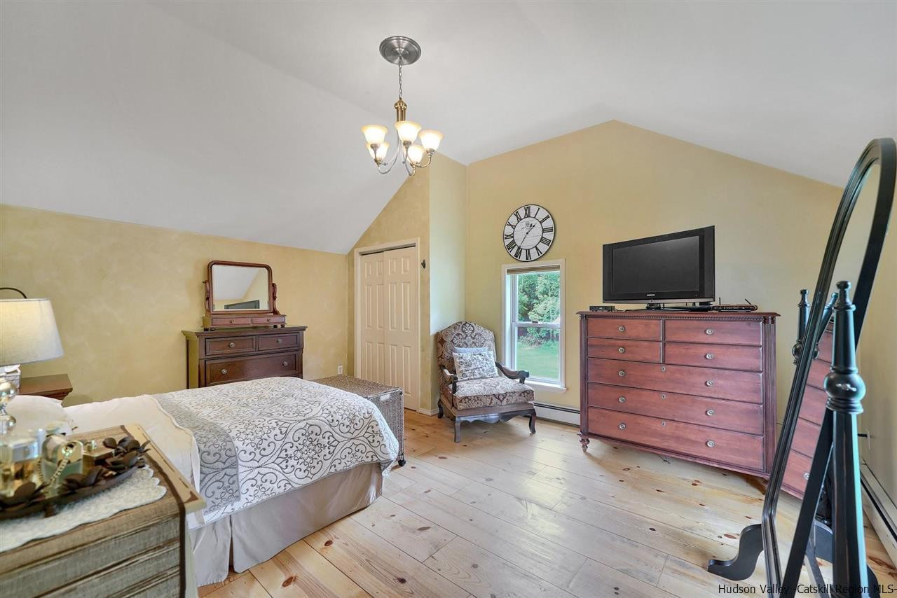 78 E Road Wallkill, NY 12589 - Photo 15 of 27 a bedroom with a bed and wooden floor