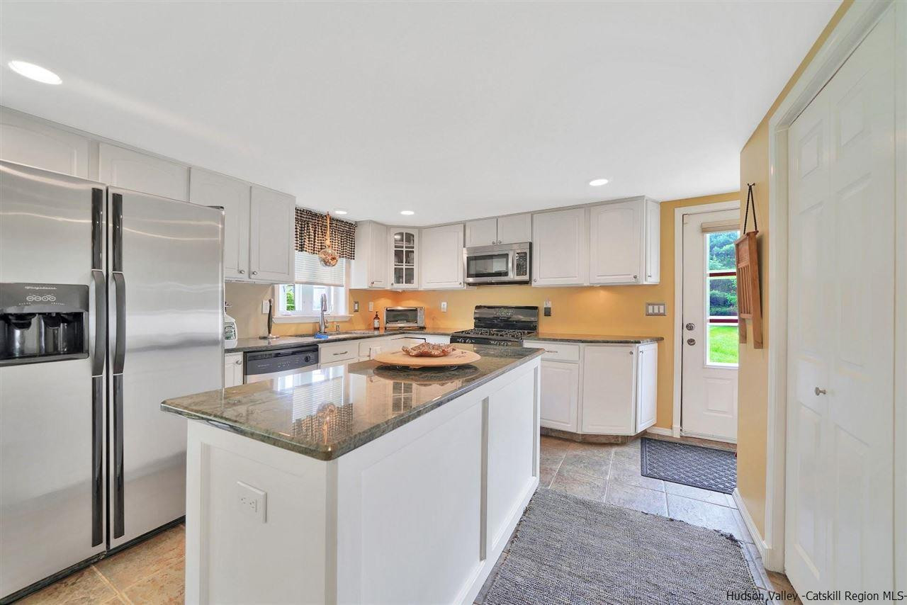 78 E Road Wallkill, NY 12589 - Photo 2 of 27 a kitchen with a refrigerator sink and cabinets