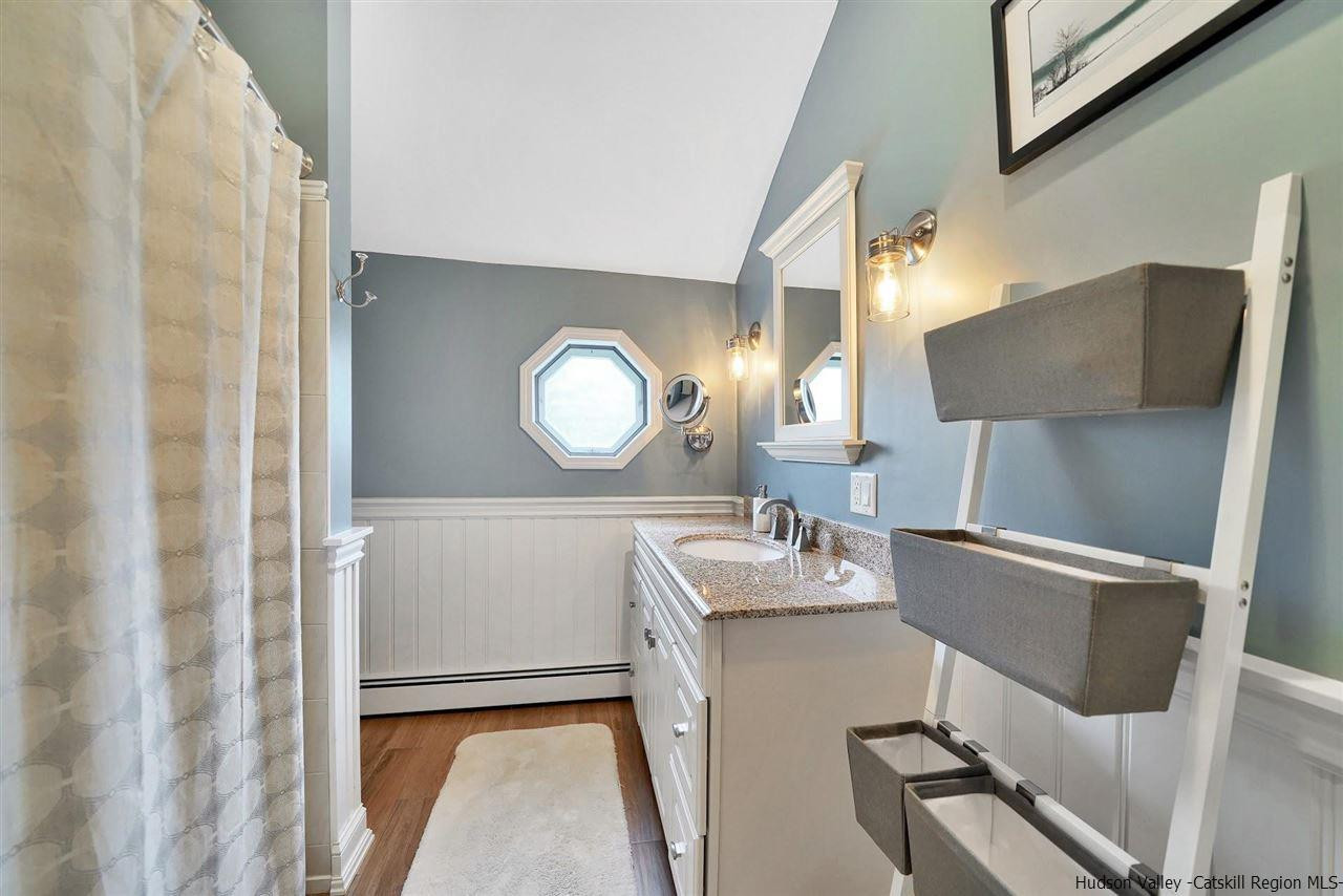 78 E Road Wallkill, NY 12589 - Photo 22 of 27 a bathroom with a sink mirror and vanity