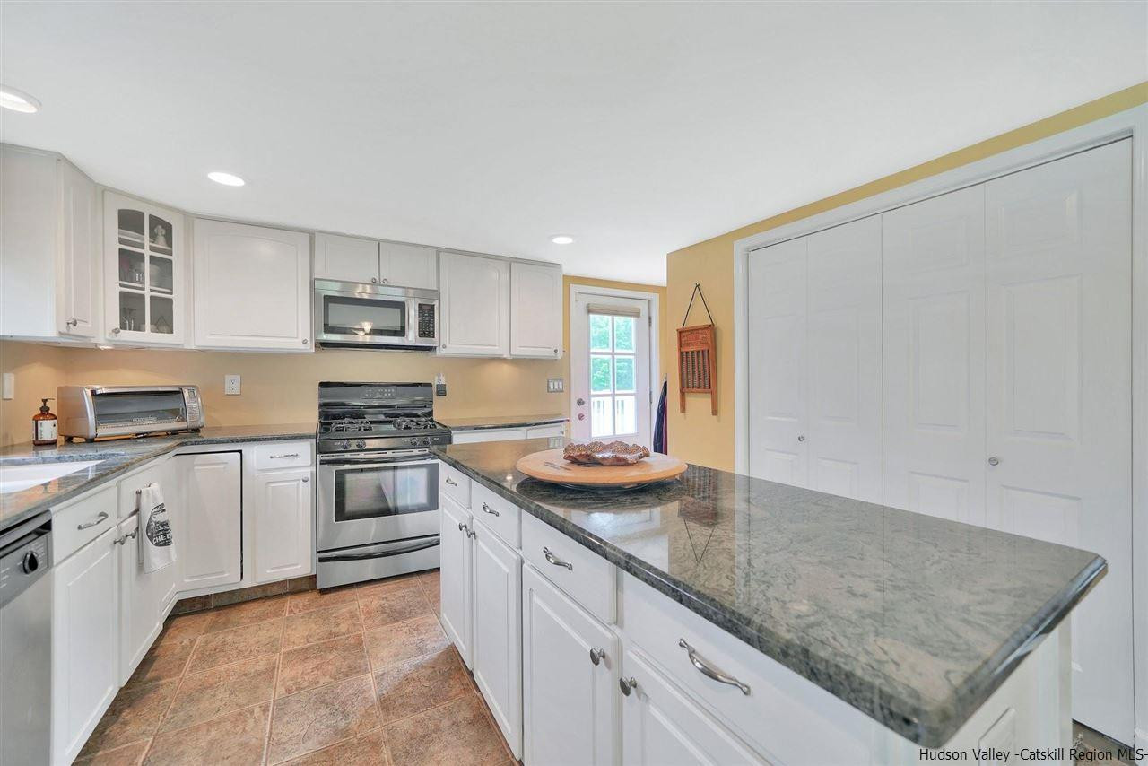 78 E Road Wallkill, NY 12589 - Photo 3 of 27 a kitchen with stainless steel appliances granite countertop a sink stove and cabinets