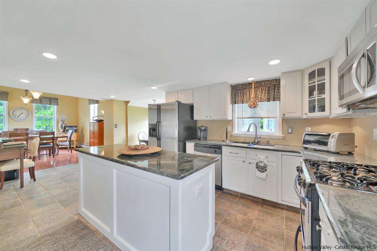 78 E Road Wallkill, NY 12589 - Photo 4 of 27 a kitchen with stainless steel appliances granite countertop a sink stove and cabinets