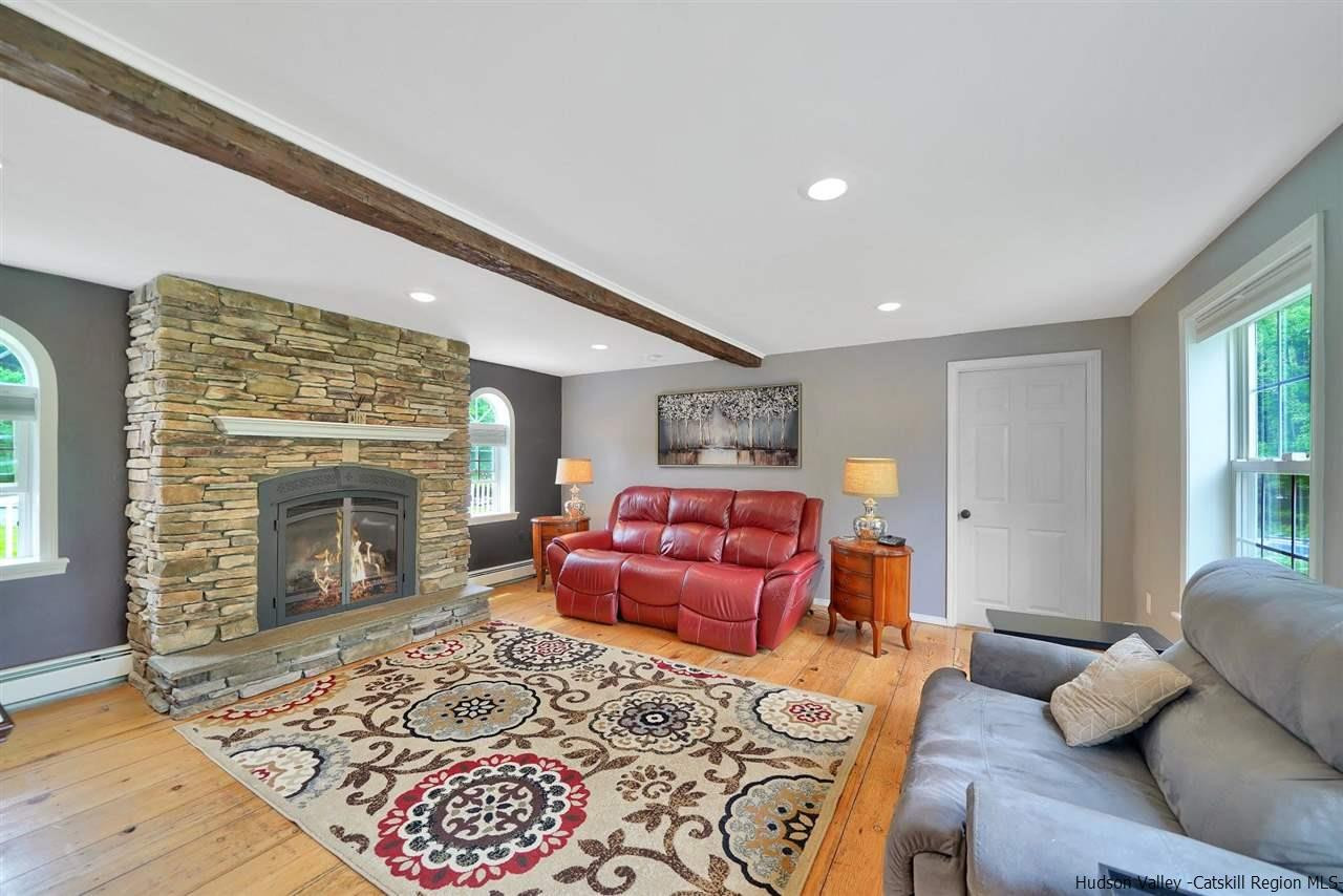 78 E Road Wallkill, NY 12589 - Photo 10 of 27 a living room with furniture and a fireplace