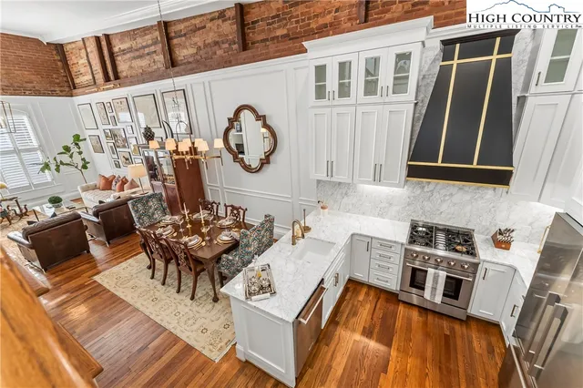 a view of a dining room with furniture window and wooden floor