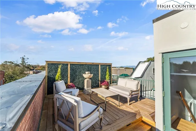 a view of balcony with furniture