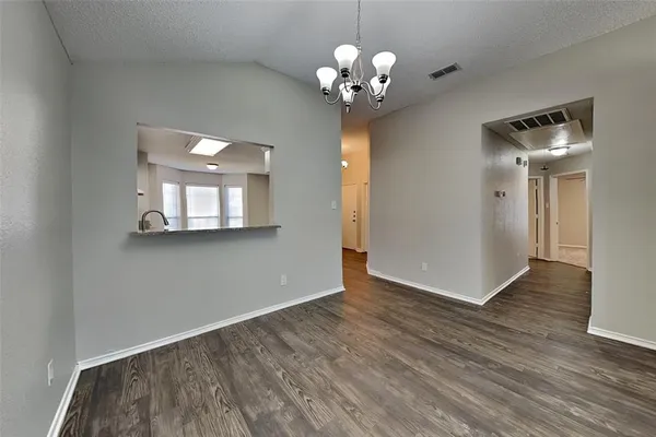 a view of a livingroom with wooden floor