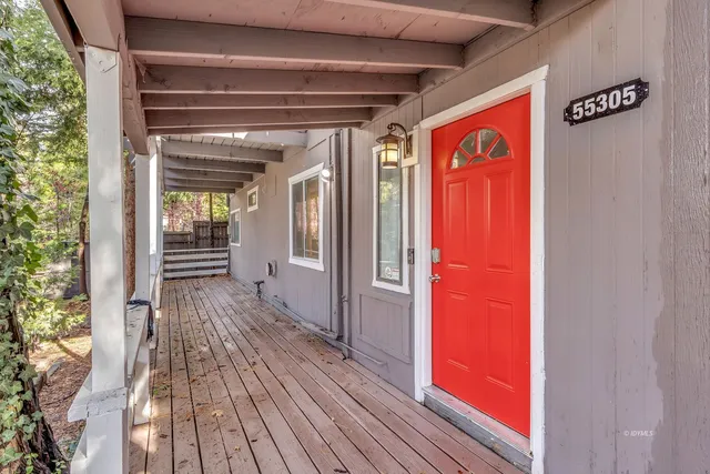 a view of a living room with wooden floor