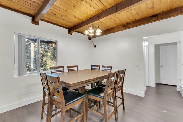 a kitchen with stainless steel appliances granite countertop a sink and a refrigerator