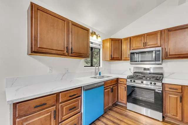 a backyard of a house with table and chairs