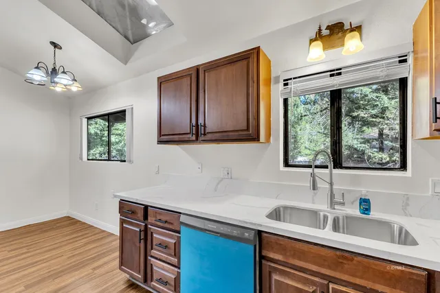 a view of balcony with wooden floor and fence
