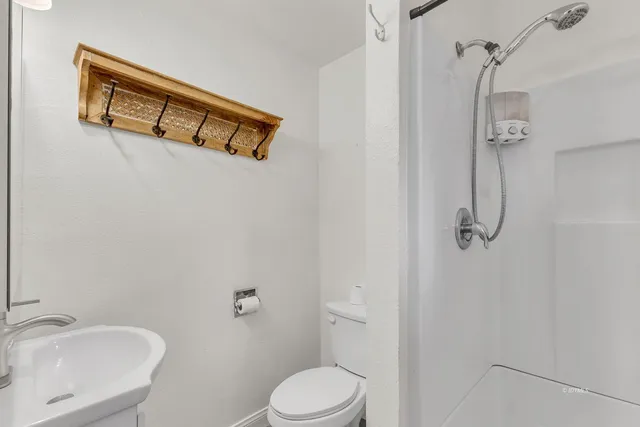a view of a wooden fence and trees