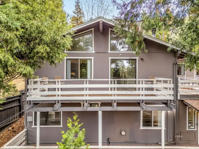 a house view with a backyard space