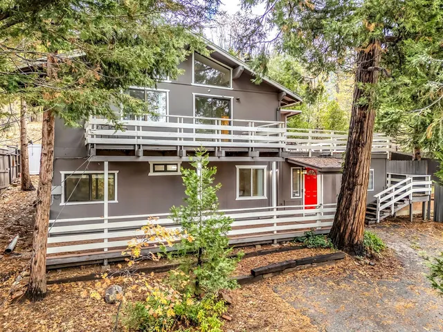 a view of a house with wooden floor and iron stairs