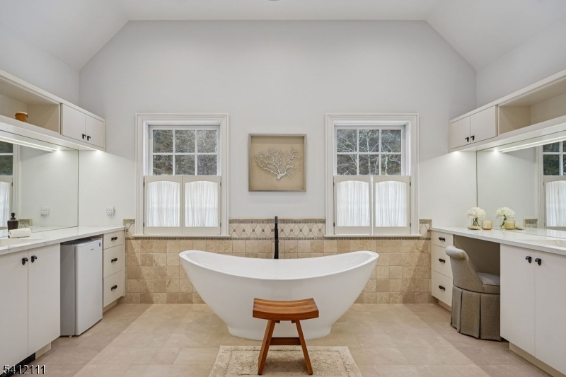 89 Mosle Road Peapack-Gladstone, NJ 07931 - Photo 21 of 50 a spacious bathroom with a sink double vanity and a tub