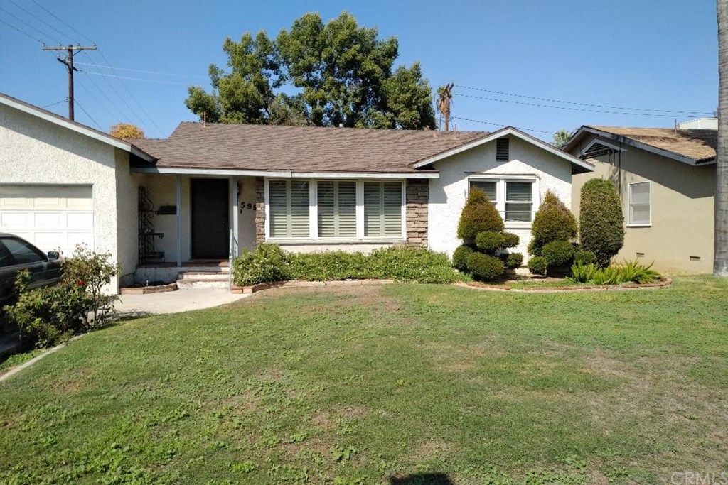 3599 Nelson Street Riverside, CA 92506 - Photo 1 of 1 a front view of a house with a garden