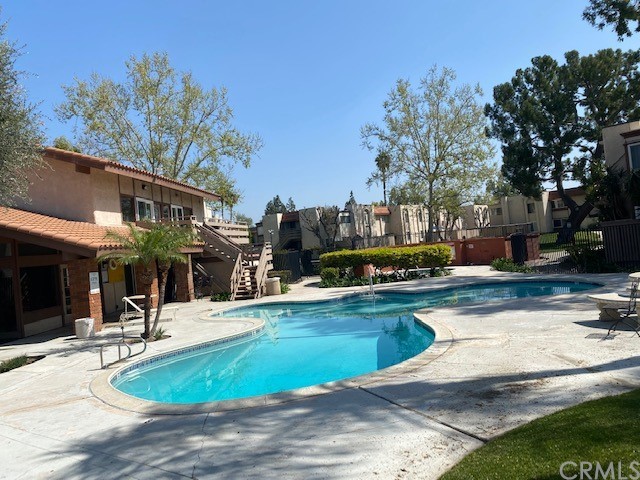 212 South Kraemer Boulevard, Unit 1205 Placentia, CA 92870 - Photo 1 of 11 a view of a swimming pool with a patio