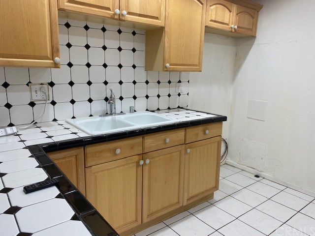 212 South Kraemer Boulevard, Unit 1205 Placentia, CA 92870 - Photo 6 of 11 a utility room with stainless steel appliances a sink and a cabinets