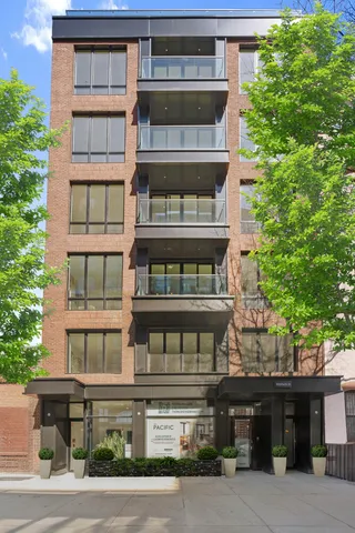a picture of a living room with a rug and a window