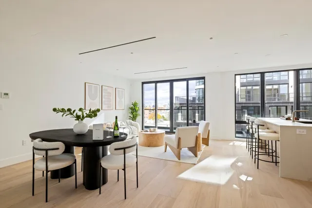 a bedroom with a large bed and a large window