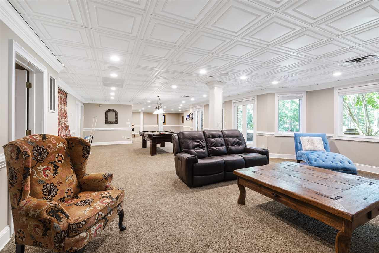 1102 Stonebridge Drive Durham, NC 27712 - Photo 21 of 30 a living room with furniture and wooden floor
