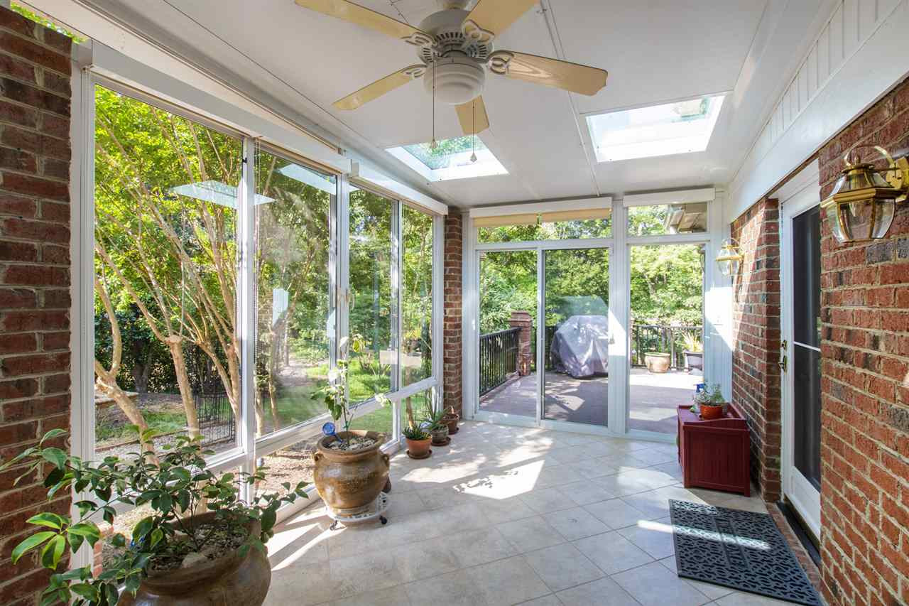 1102 Stonebridge Drive Durham, NC 27712 - Photo 26 of 30 a living room filled with furniture and a potted plant