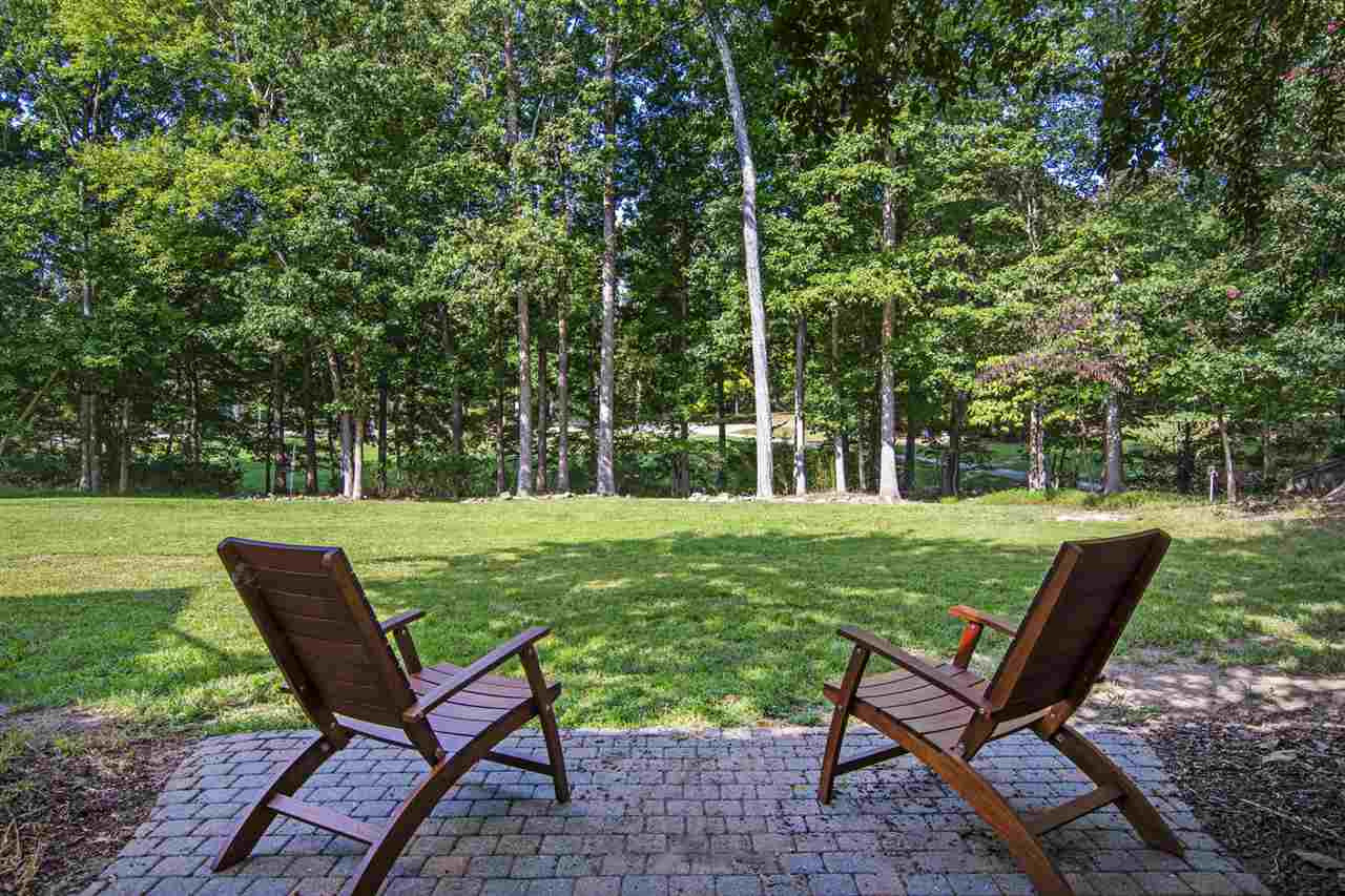 1102 Stonebridge Drive Durham, NC 27712 - Photo 27 of 30 a view of a two chairs in a yard