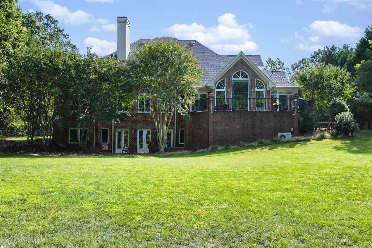 1102 Stonebridge Drive Durham, NC 27712 - Photo 29 of 30 a front view of a house with a yard and trees