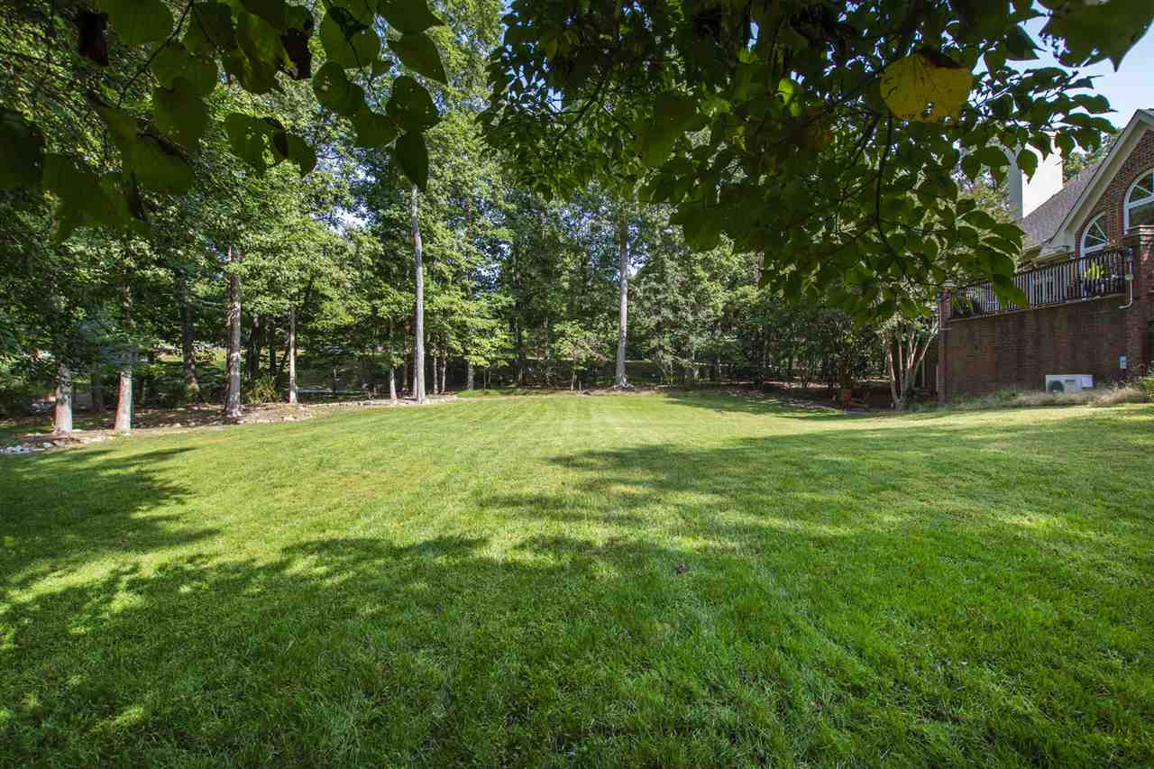 1102 Stonebridge Drive Durham, NC 27712 - Photo 30 of 30 a view of green field with trees in the background
