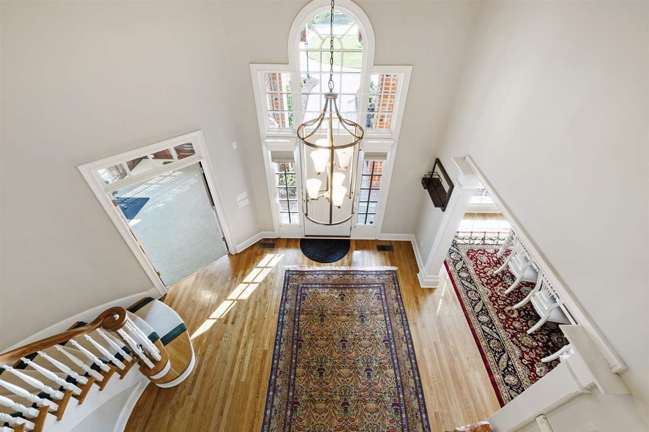 1102 Stonebridge Drive Durham, NC 27712 - Photo 3 of 30 a view of a living room with a bed and a window