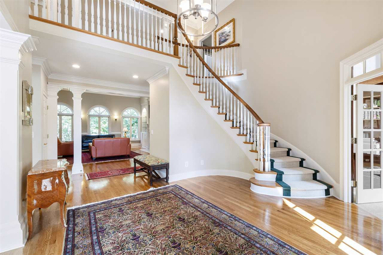 1102 Stonebridge Drive Durham, NC 27712 - Photo 4 of 30 a view of entryway and hall with wooden floor