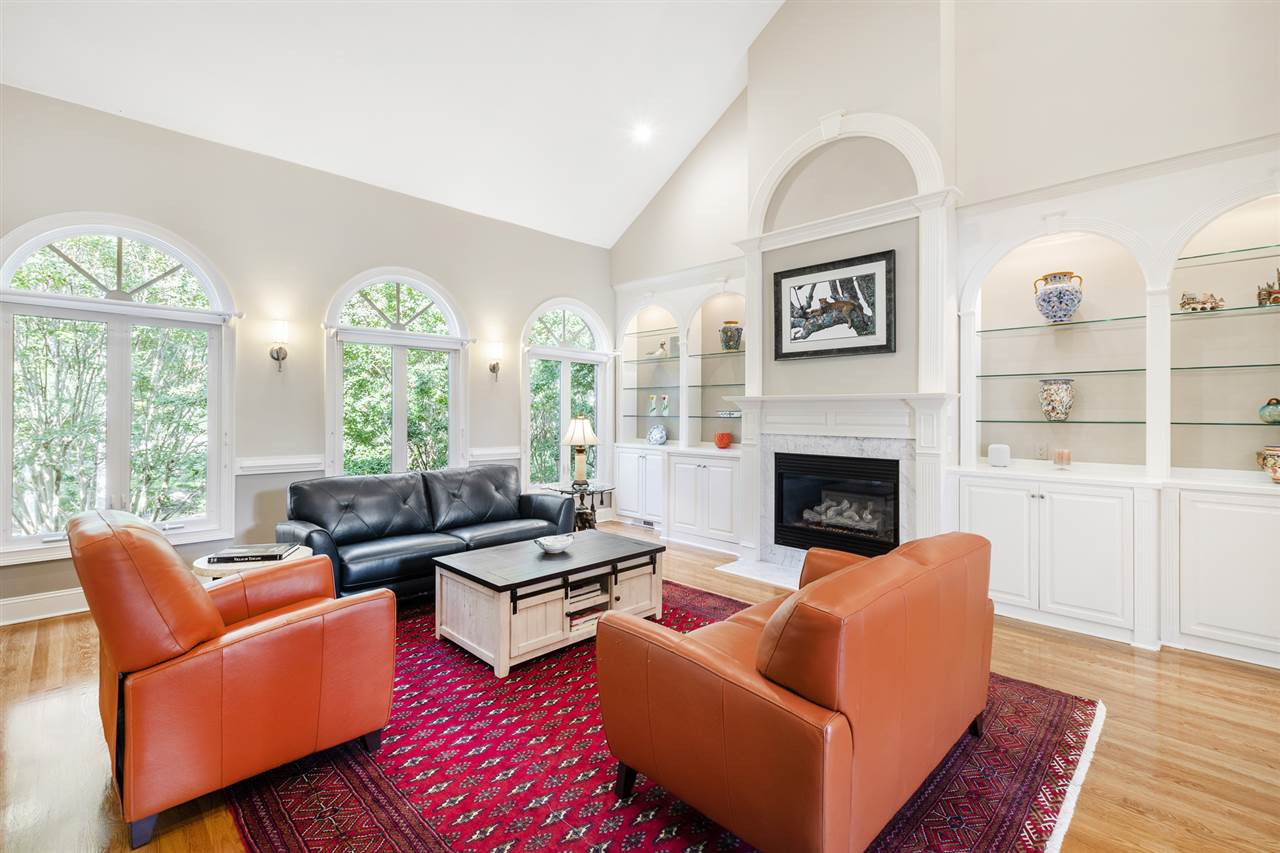 1102 Stonebridge Drive Durham, NC 27712 - Photo 8 of 30 a living room with furniture fireplace and large windows