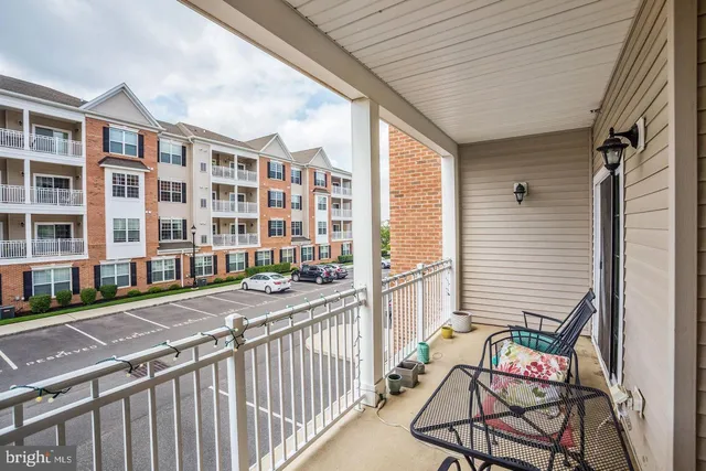a balcony view with a seating space