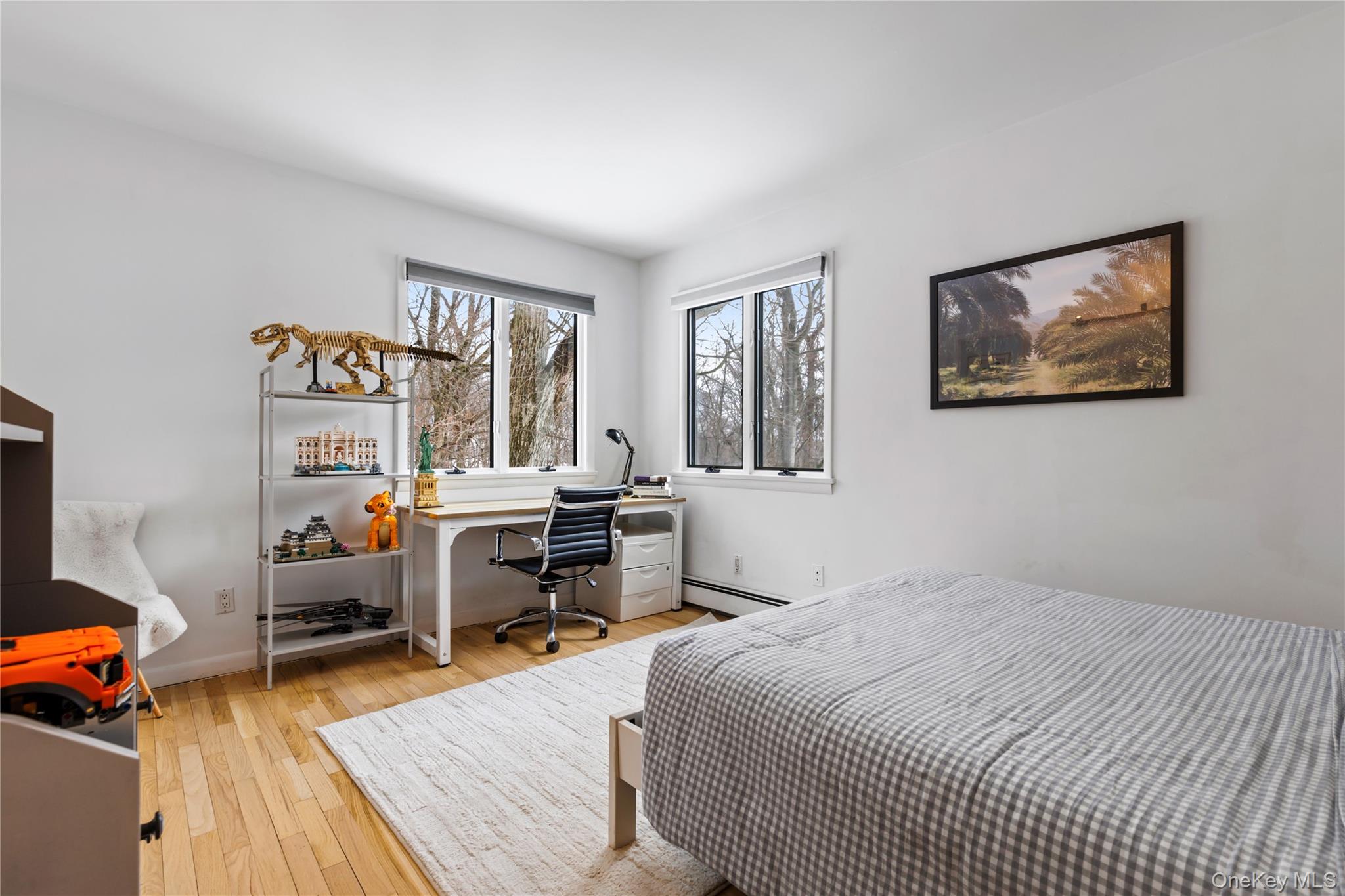 205 Polly Park Road Rye, NY 10580 - Photo 13 of 33 a bedroom with a bed and wooden floor