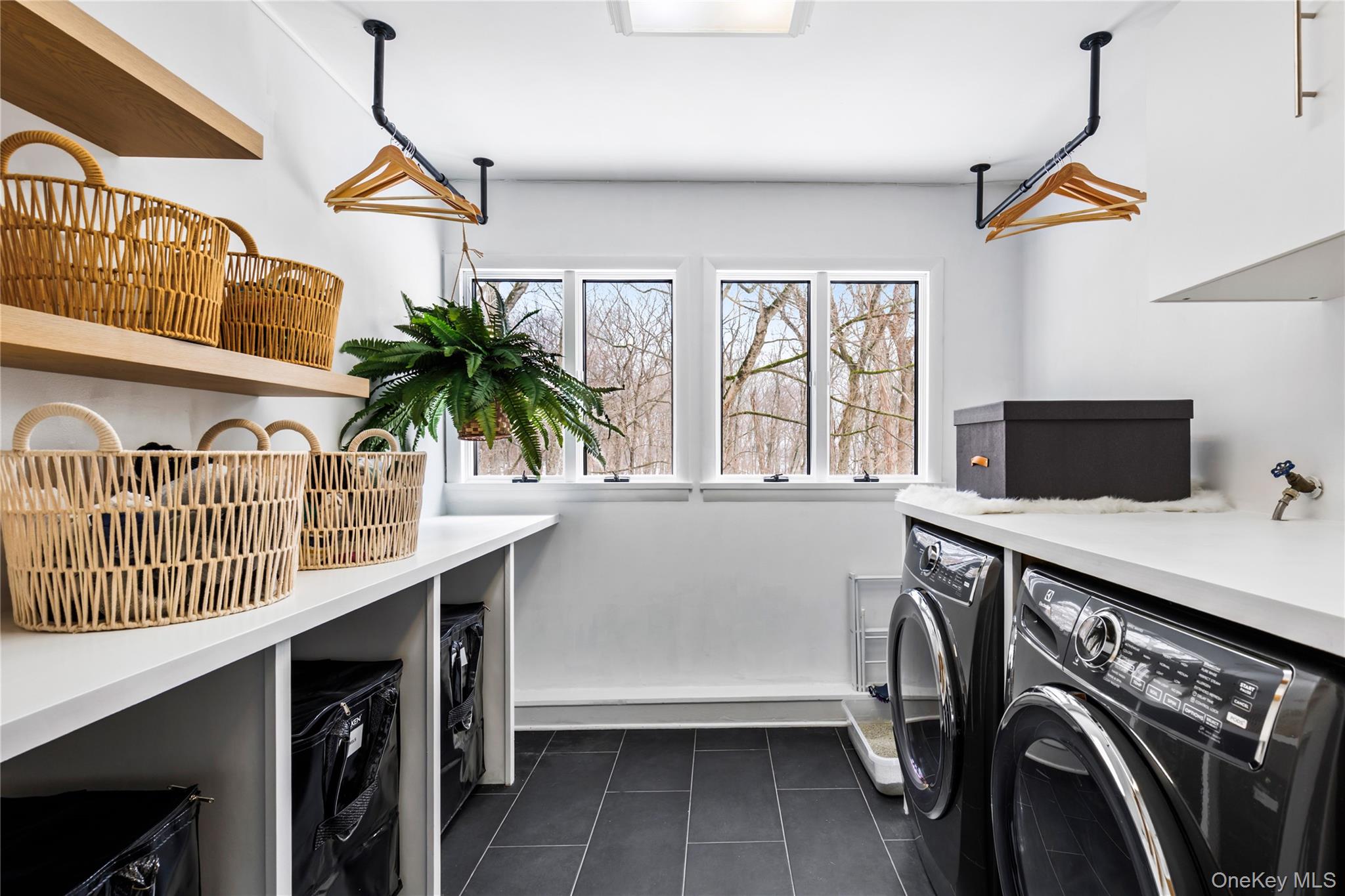 205 Polly Park Road Rye, NY 10580 - Photo 14 of 33 a kitchen with a refrigerator and a window
