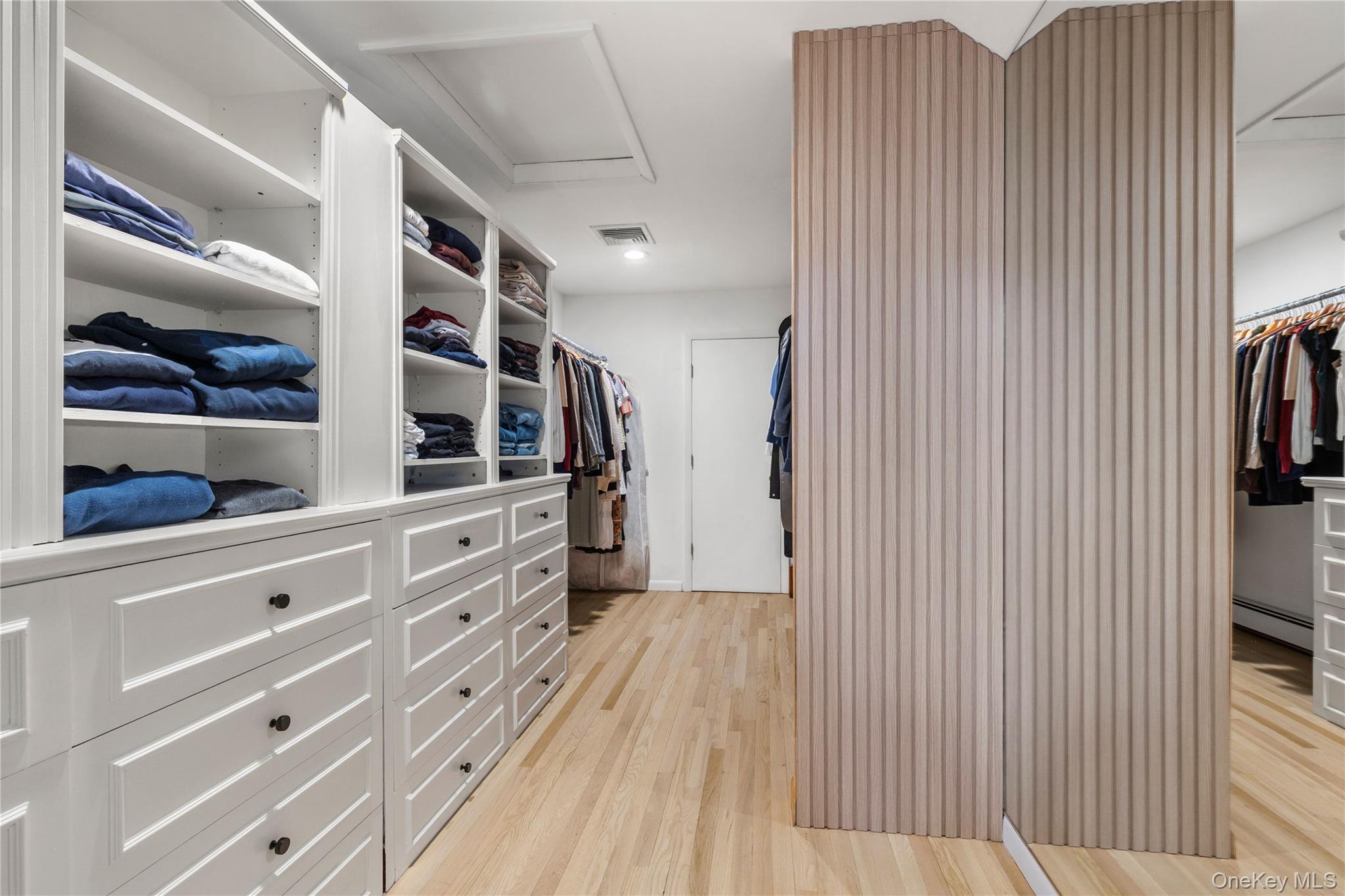 205 Polly Park Road Rye, NY 10580 - Photo 17 of 33 a view of walk in closet with clothes and shoes