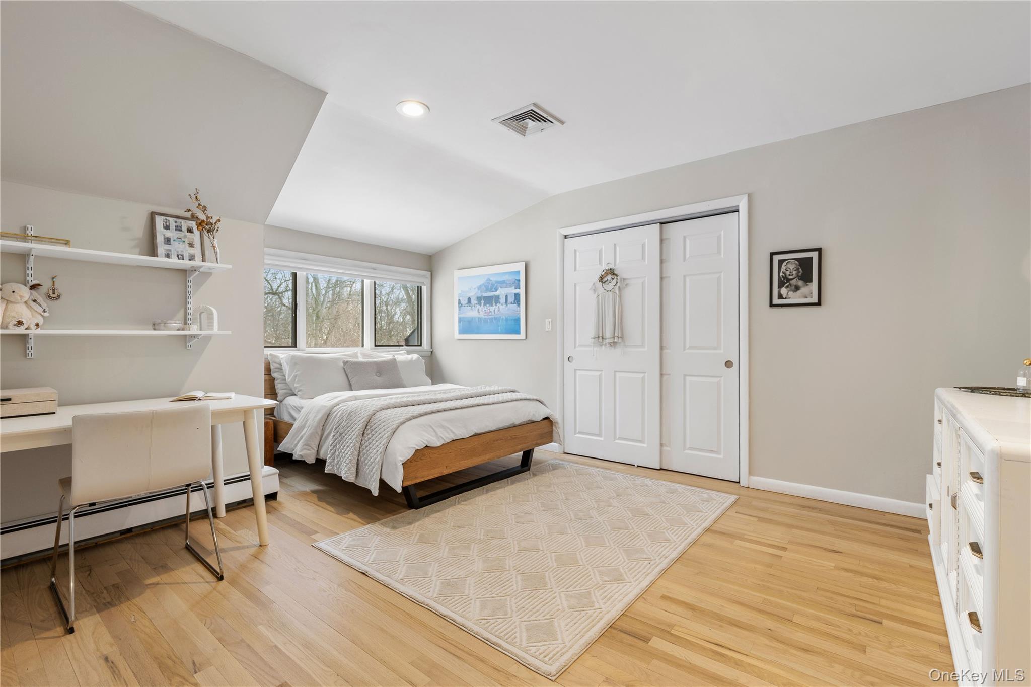 205 Polly Park Road Rye, NY 10580 - Photo 20 of 33 a bedroom with a bed and window