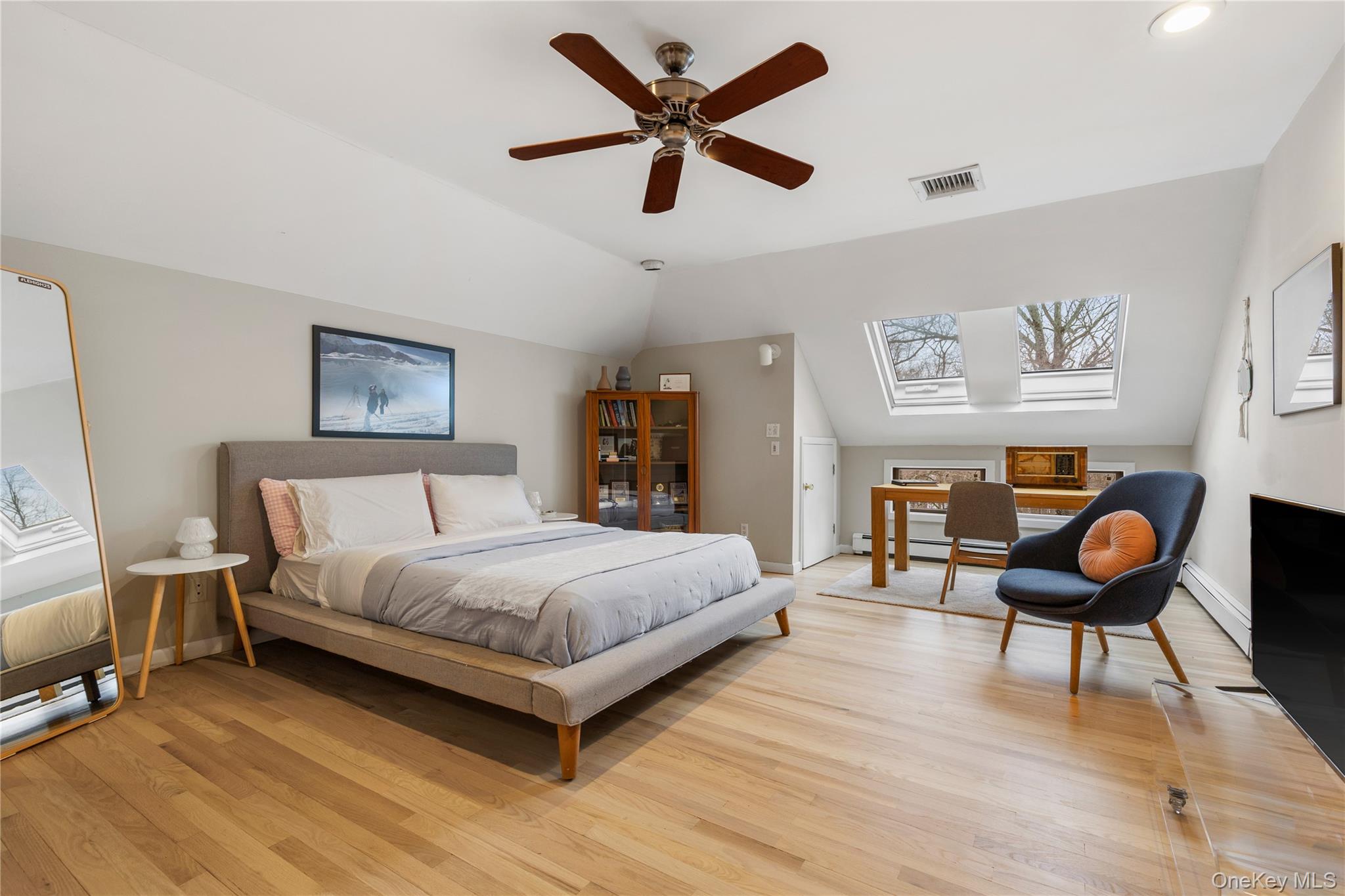 205 Polly Park Road Rye, NY 10580 - Photo 21 of 33 a bedroom with a bed and wooden floor
