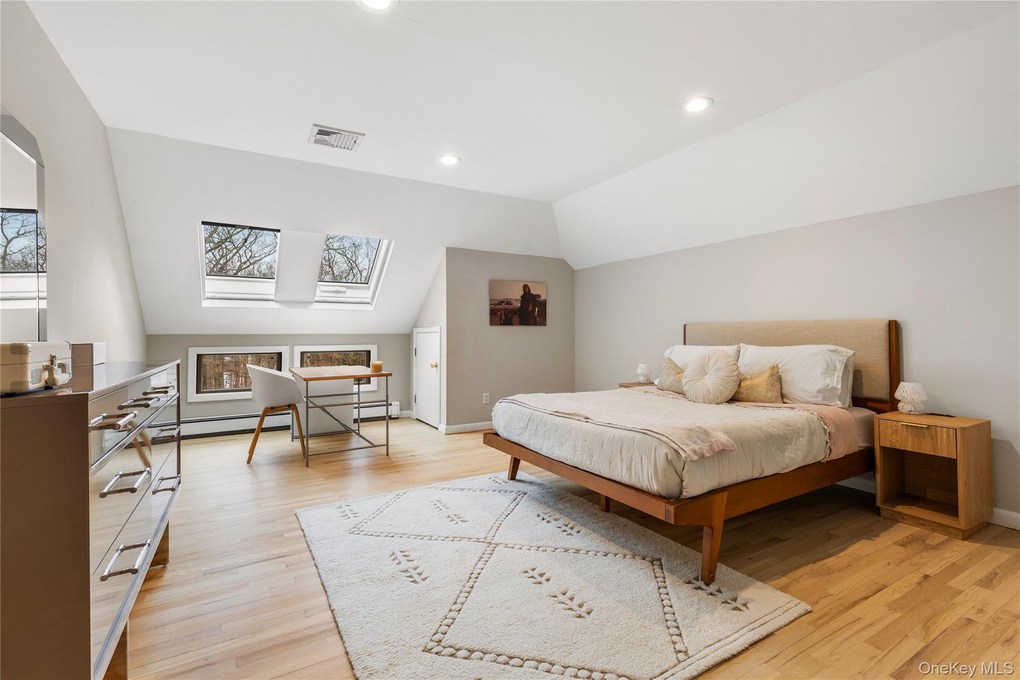 205 Polly Park Road Rye, NY 10580 - Photo 22 of 33 a bedroom with a bed a table and chair