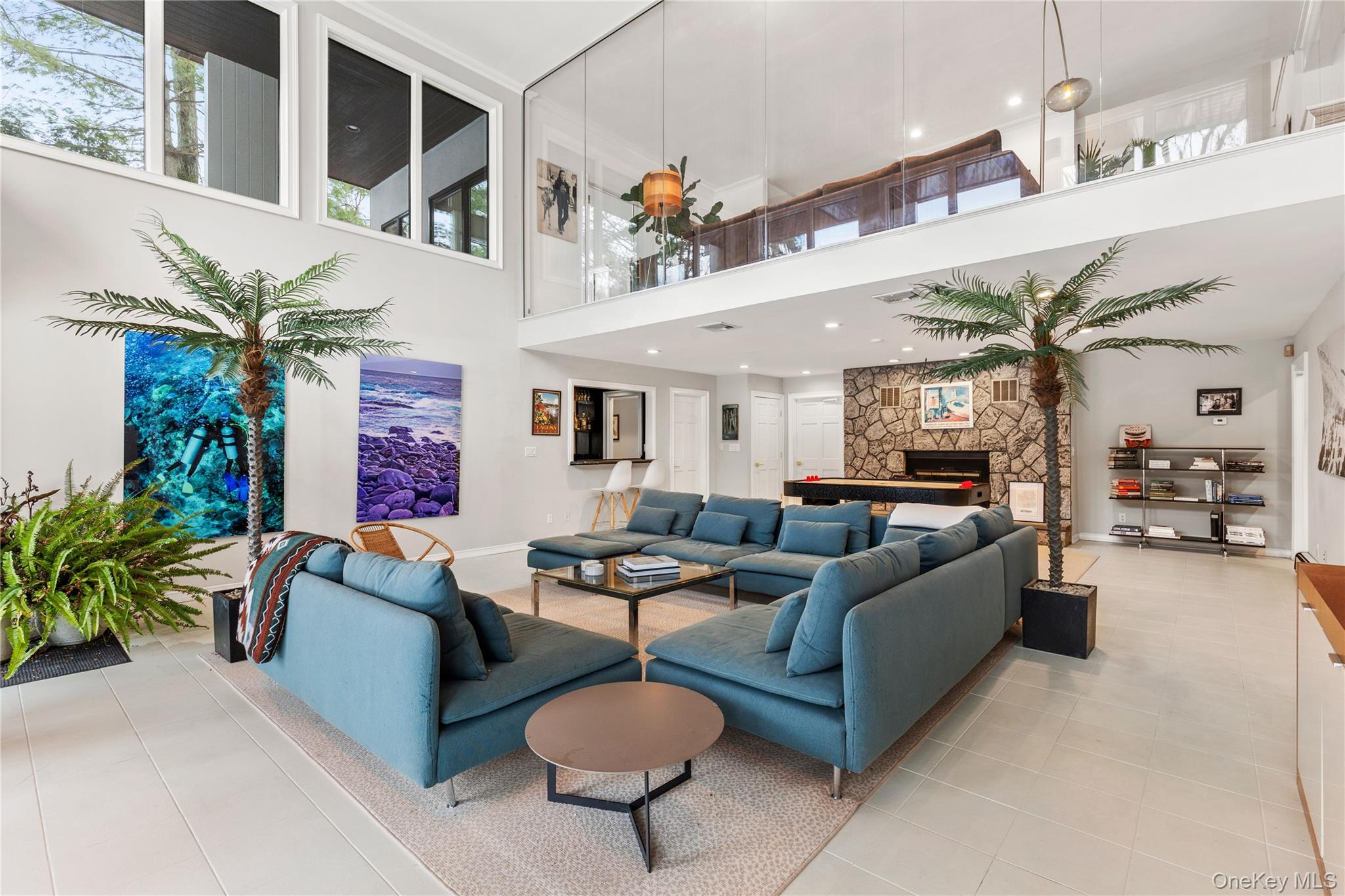 205 Polly Park Road Rye, NY 10580 - Photo 25 of 33 a living room with furniture a chandelier and a potted plant