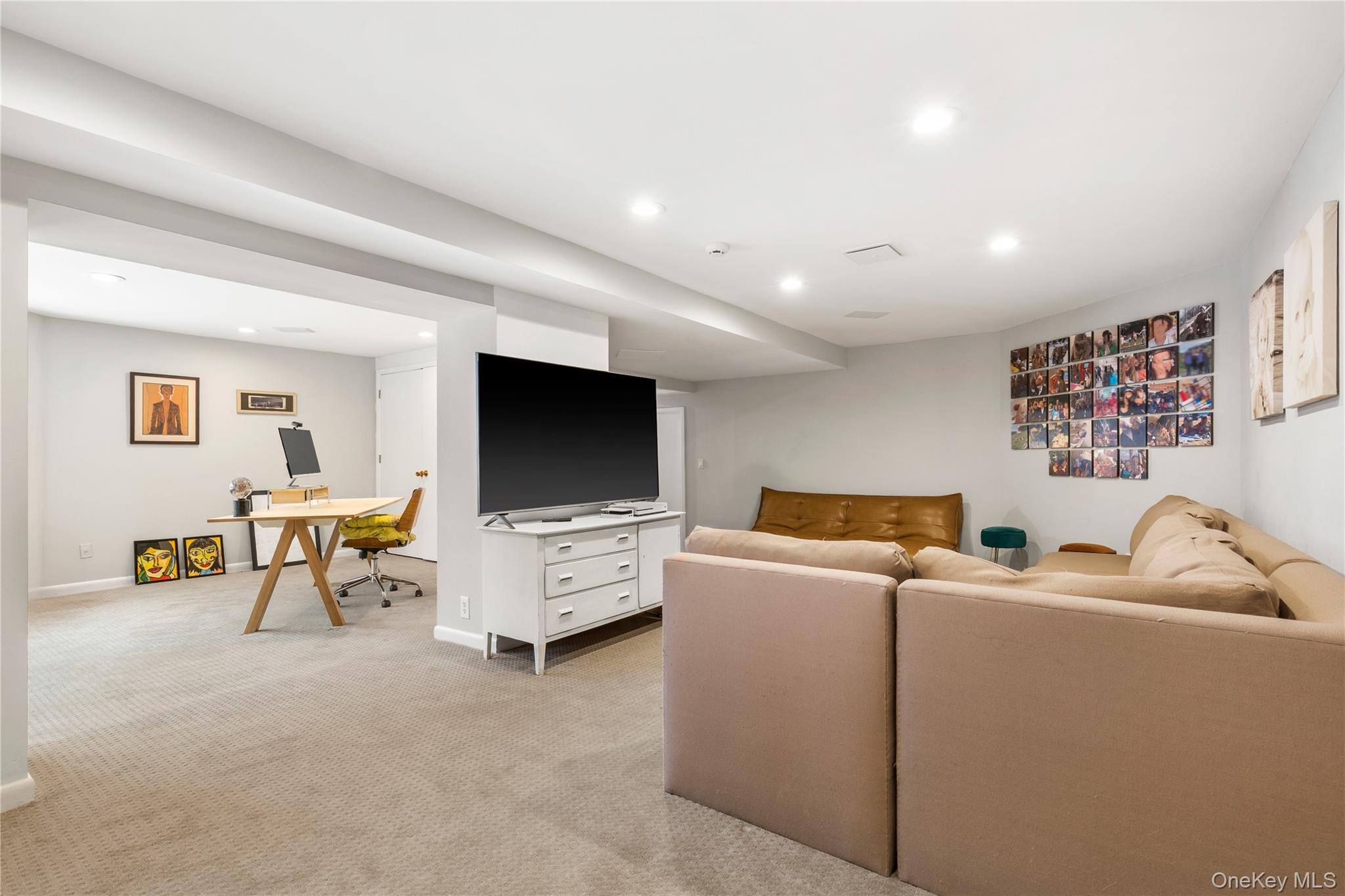 205 Polly Park Road Rye, NY 10580 - Photo 27 of 33 a living room with furniture and a flat screen tv