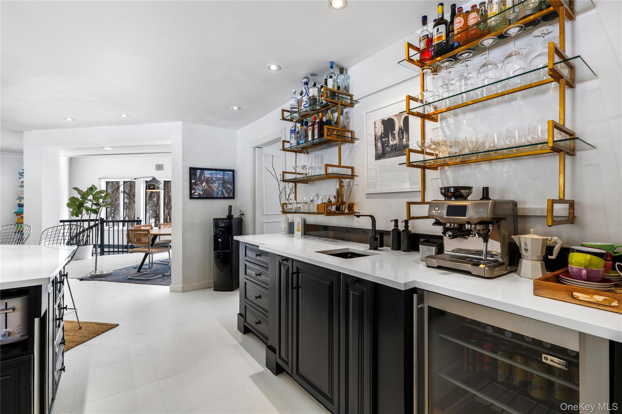 205 Polly Park Road Rye, NY 10580 - Photo 8 of 33 a kitchen with stainless steel appliances granite countertop a sink dishwasher and cabinets with wooden floor